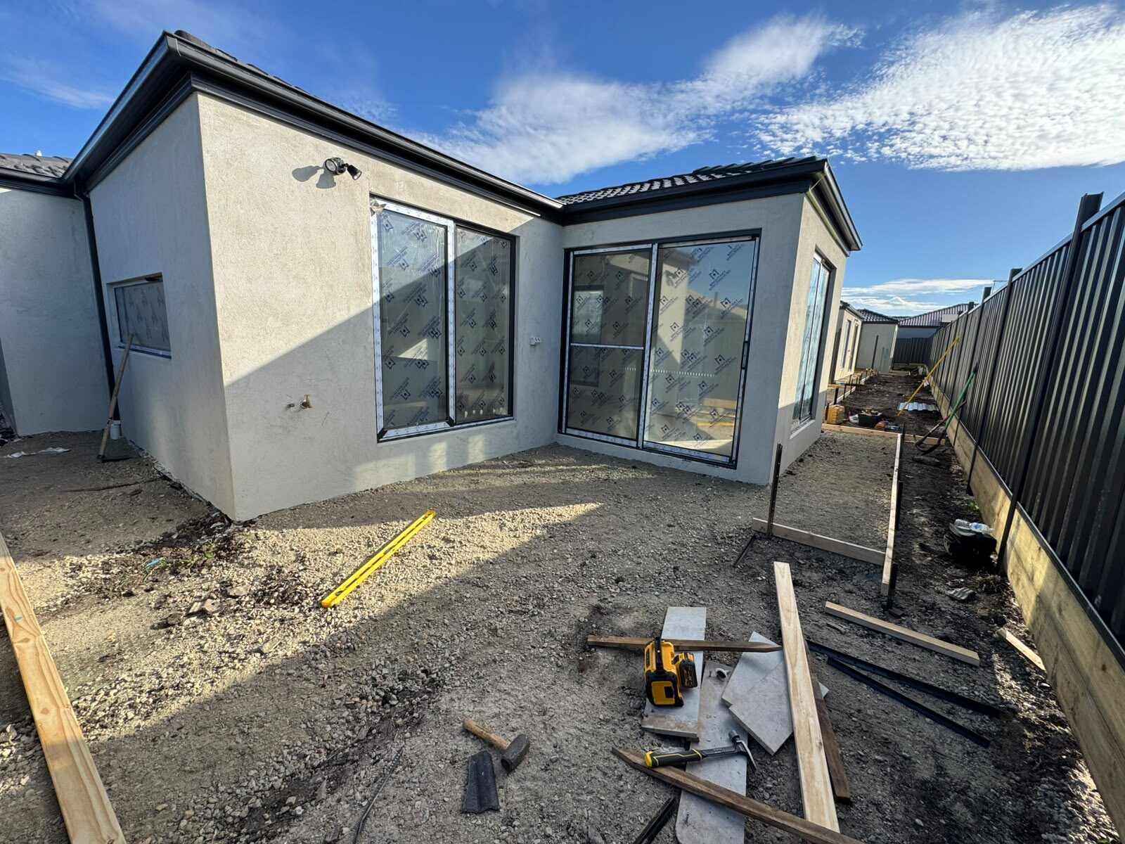 Bare dirt backyard before concreting works
