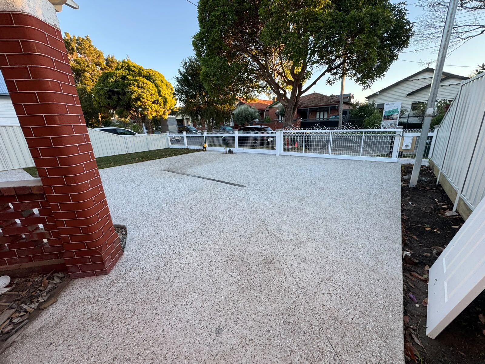 Exposed aggregate driveway across a Melbourne front yard