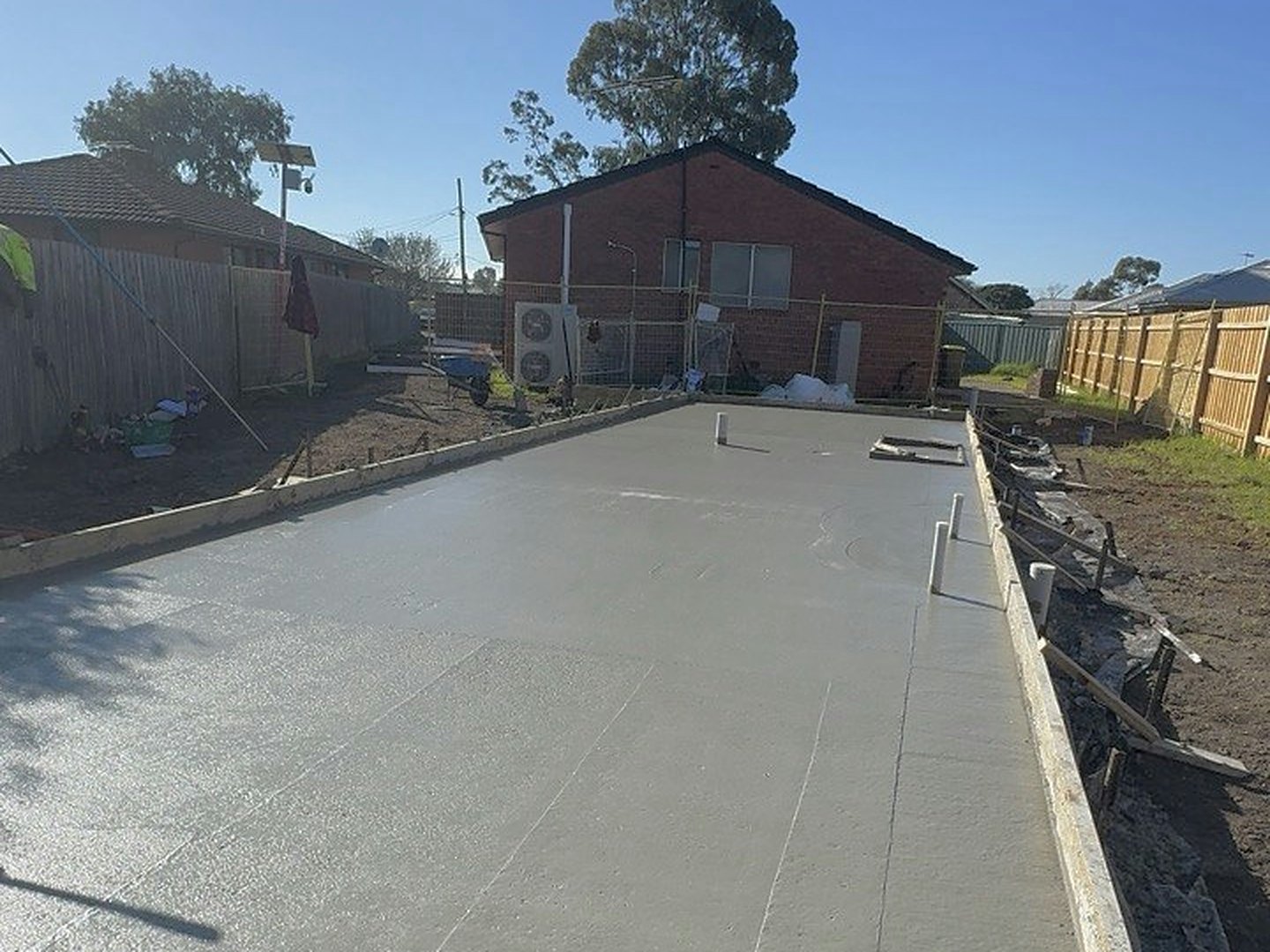 Large backyard slab poured and screeded flat with formwork still in place
