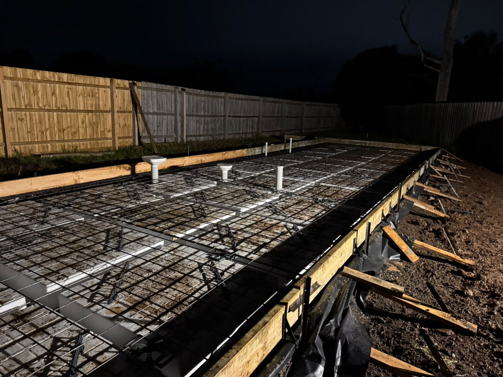 Formwork and steel set up on site at night
